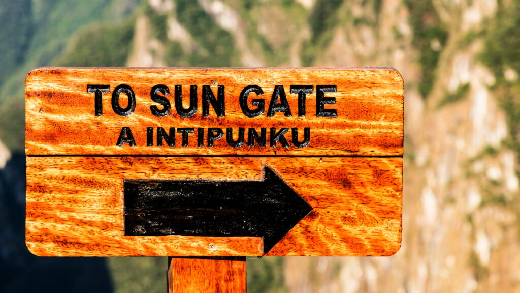 Panoramic view of Machu Picchu and the surrounding lush mountains as seen from the Sun Gate
